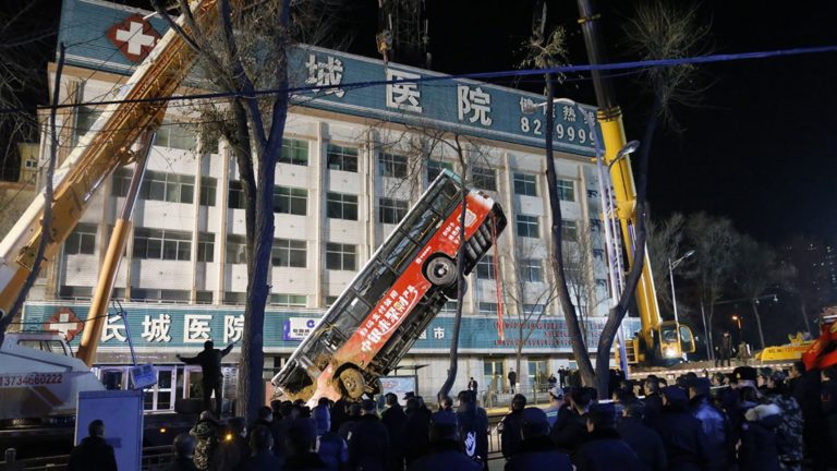 Giant Sinkhole Swallows Bus and Pedestrians in China