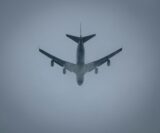 unsplash-a-large-jetliner-flying-through-a-foggy-sky-101393