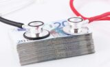 unsplash-a-pile-of-money-with-a-stethoscope-on-top-of-it-101518